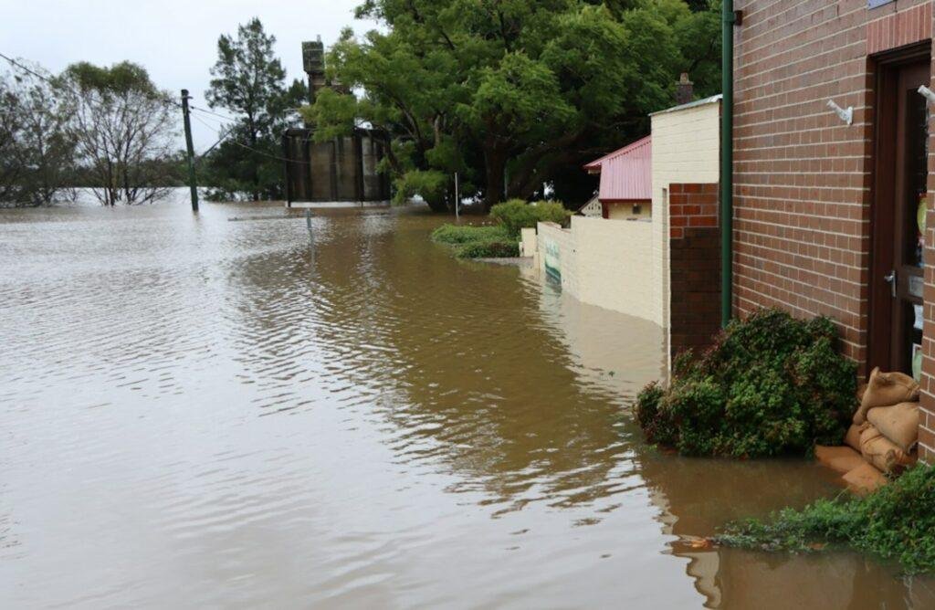 a flooded street calls for water damage restoration near me