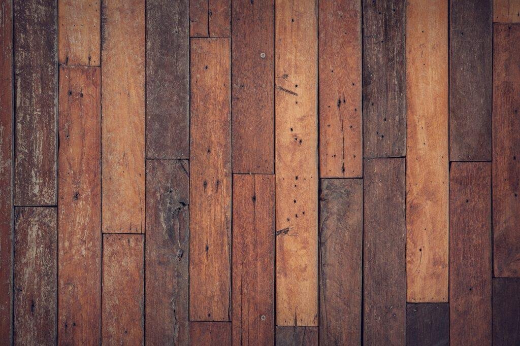 Parquet, pattern, wood flooring warped by water damage in Naples